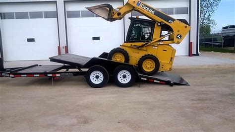 loading a skid steer onto a trailer|best trailer for skid steer.